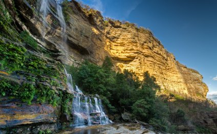 Waterfall By The Golden Cliff