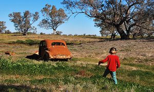 looking into a rusting classic automobile, dumped in a field outside Brewarrina